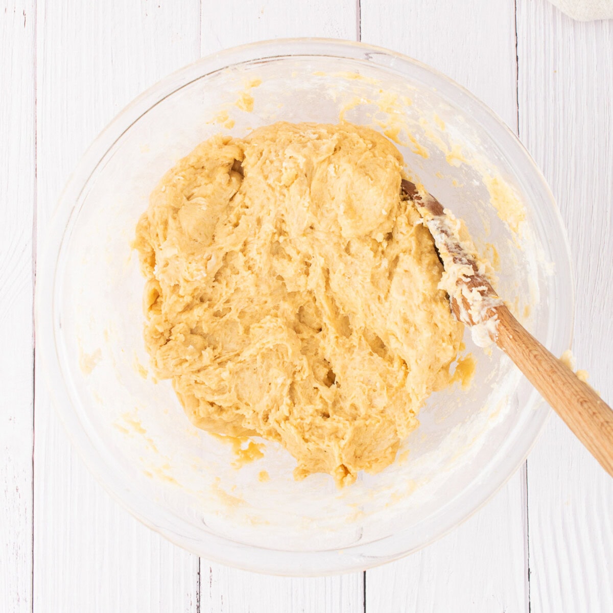 pumpkin cinnamon roll dough in a mixing bowl
