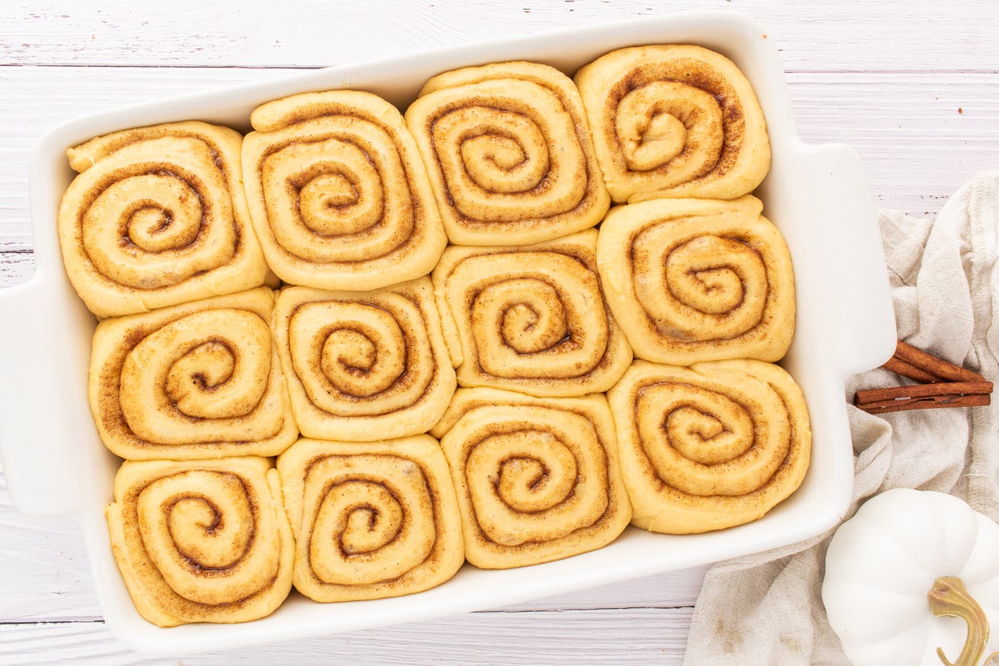 cinnamon roll dough in baking pan