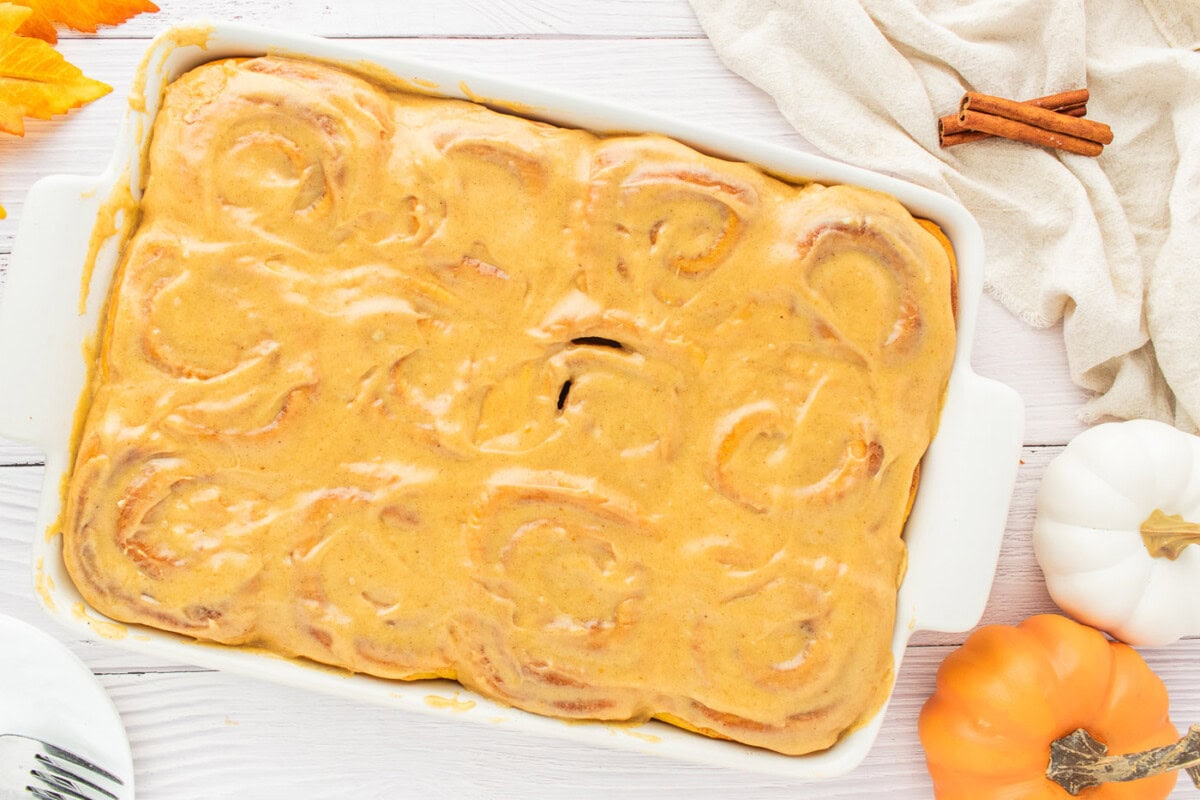 pumpkin cinnamon rolls topped with pumpkin cream cheese frosting