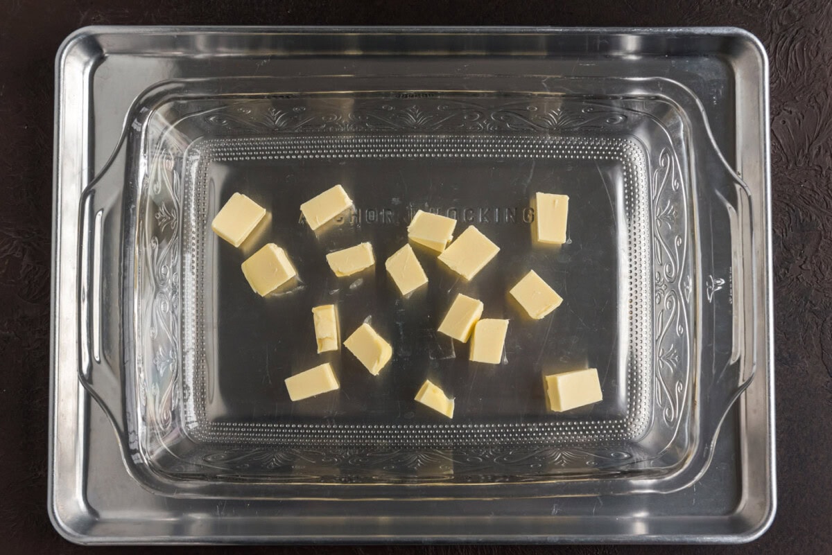 butter pats in a baking dish
