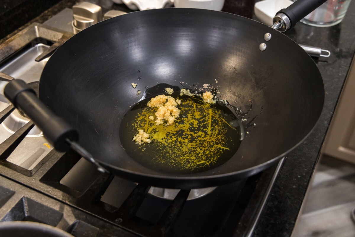 garlic in olive oil in a wok