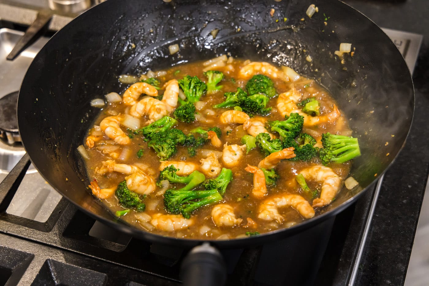 shrimp and broccoli in a wok