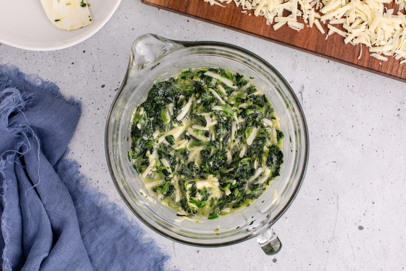 spinach souffle ingredients in a mixing bowl