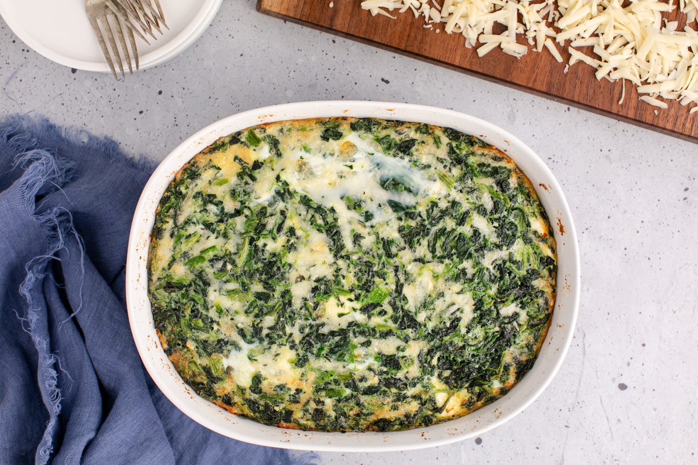 baked spinach souffle in a casserole dish