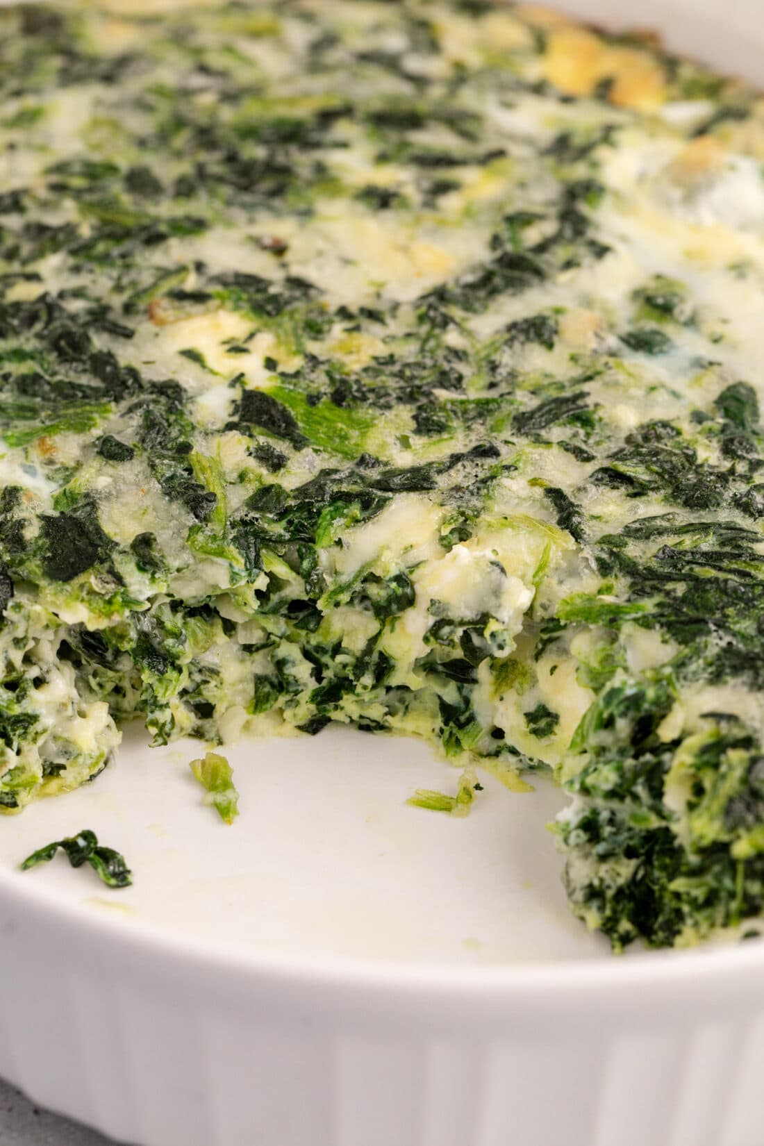 Close up photo of Spinach Souffle with a piece removed