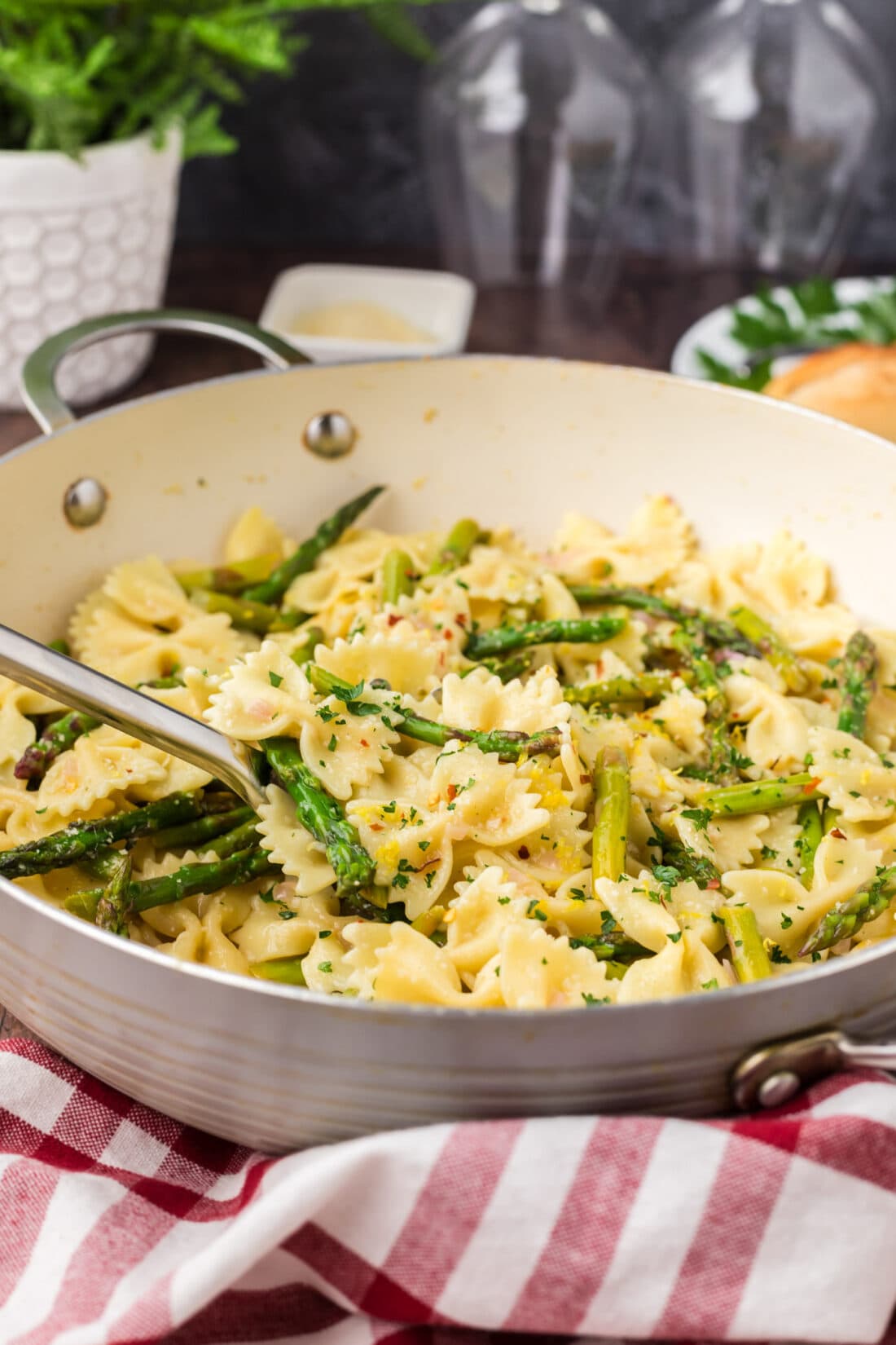 Spoon in a skillet of Asparagus Pasta