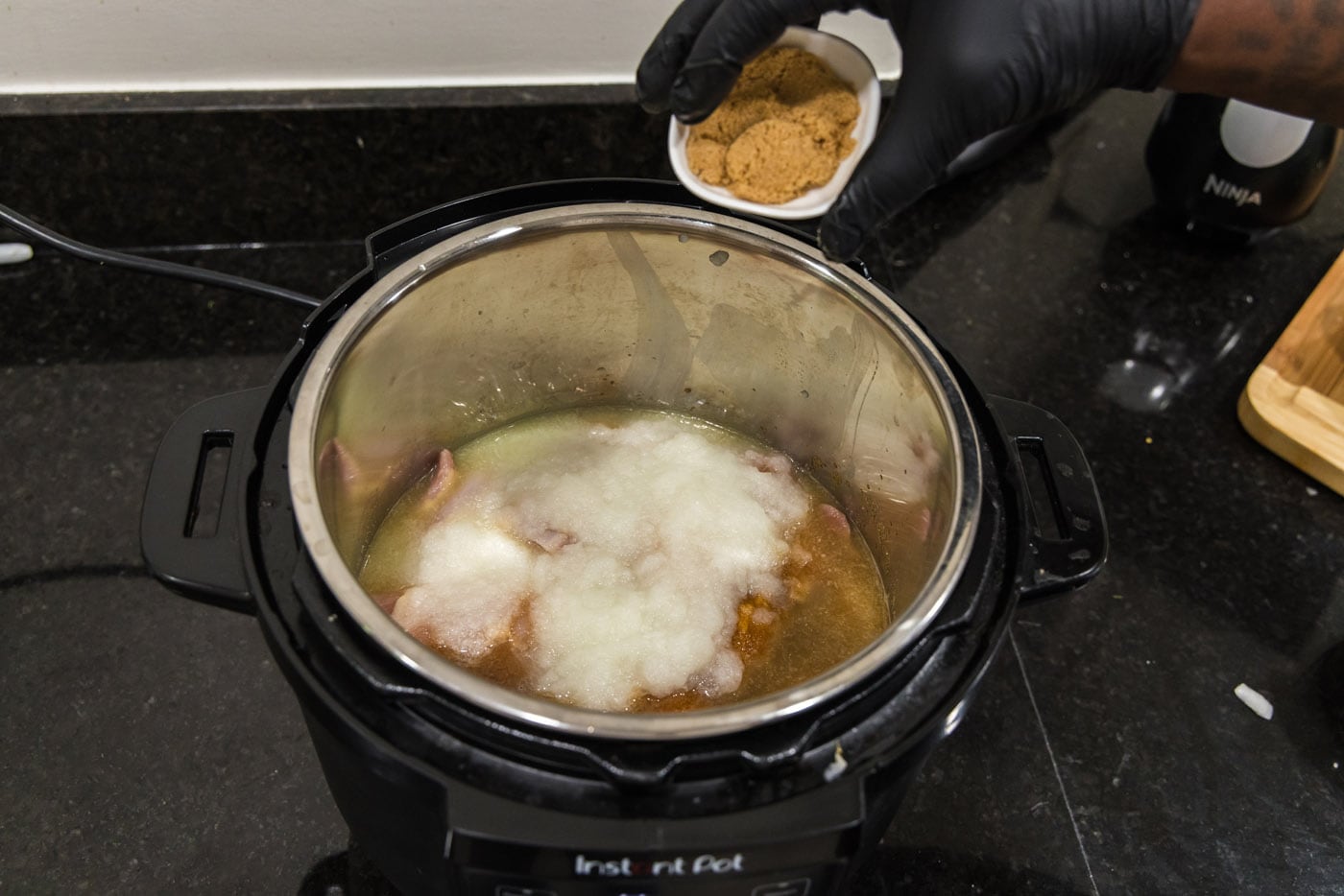 adding brown sugar to chicken mixture in instant pot