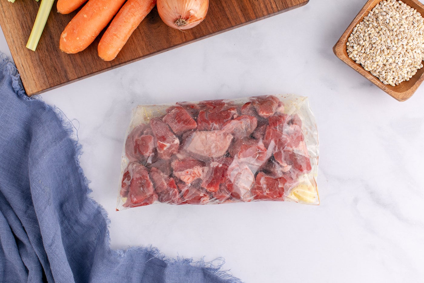 stew meat with flour and salt in bag