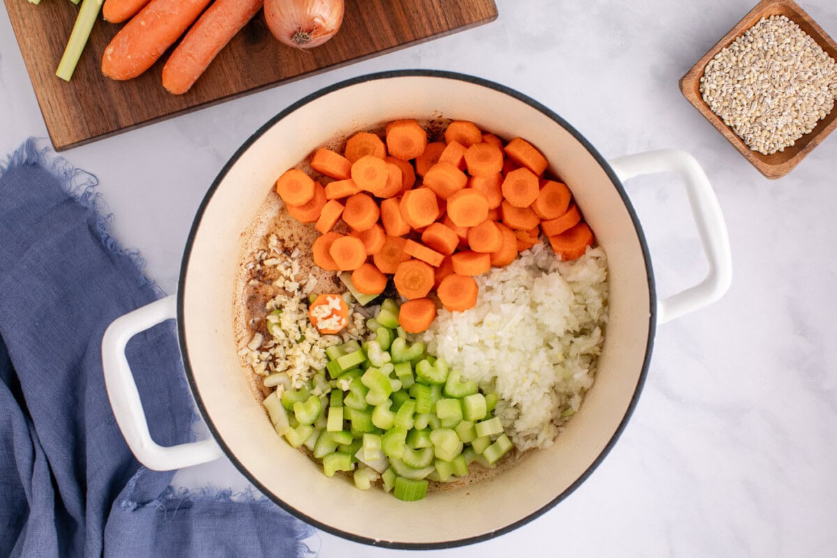 carrots, onion, celery, and garlic added to soup pot