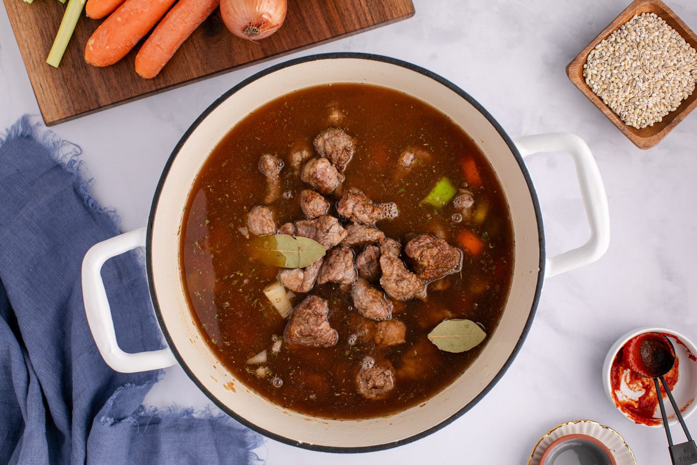 beef barley soup with beef broth in a stock pot