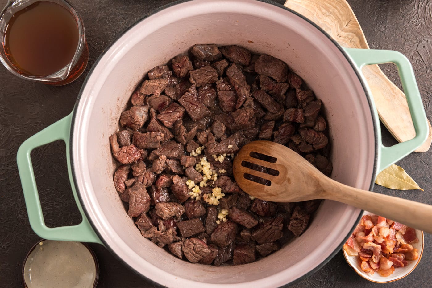 browned beef cubes in dutch oven