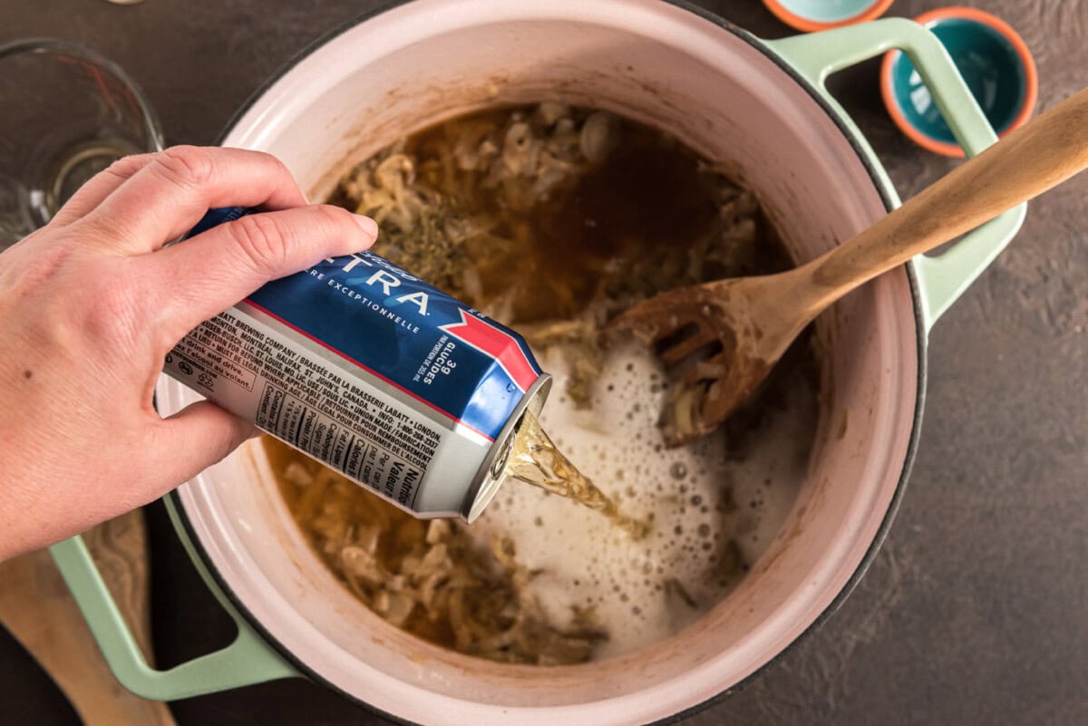 pouring beer into carbonnade