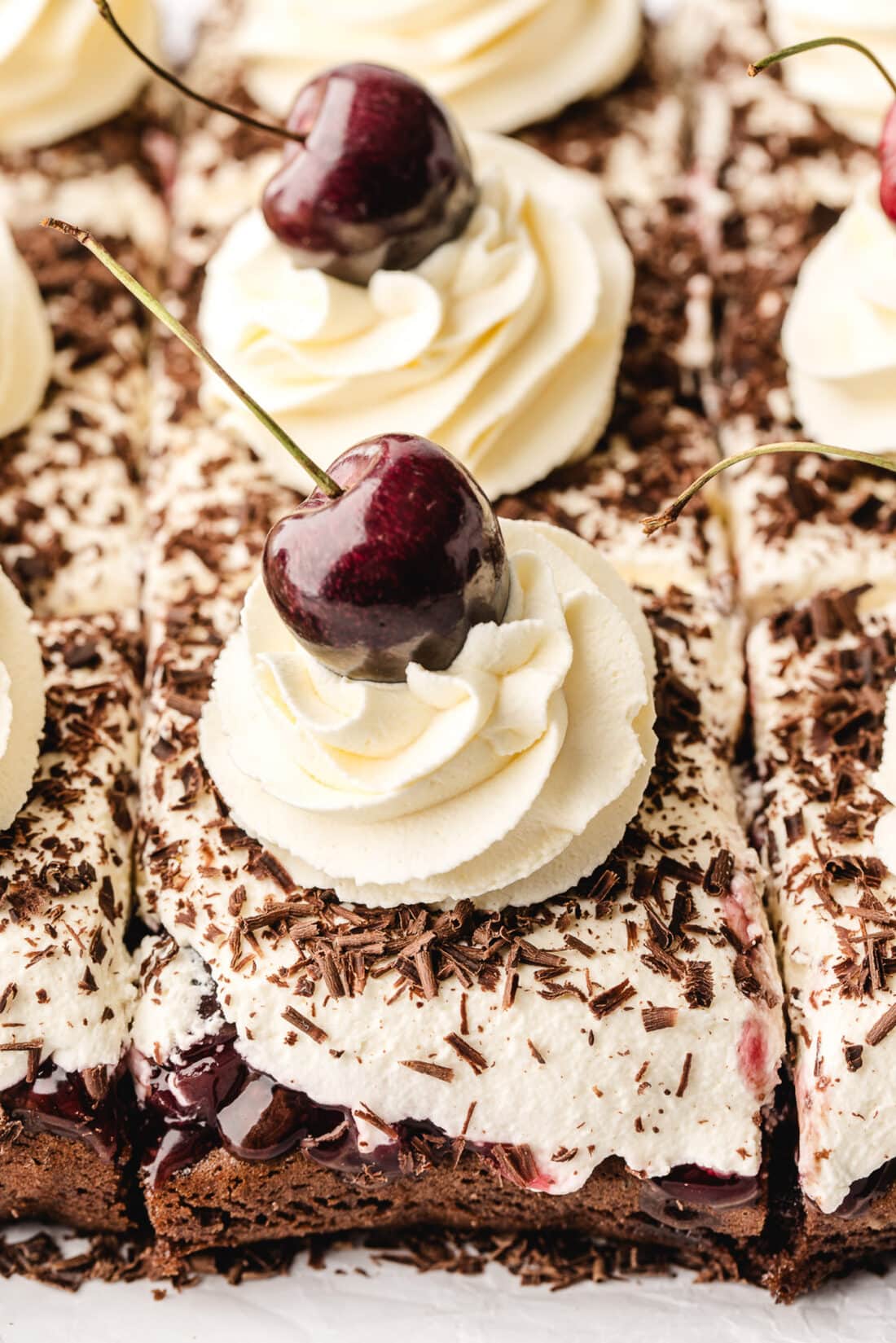 Black Forest Poke Cake cut into squares