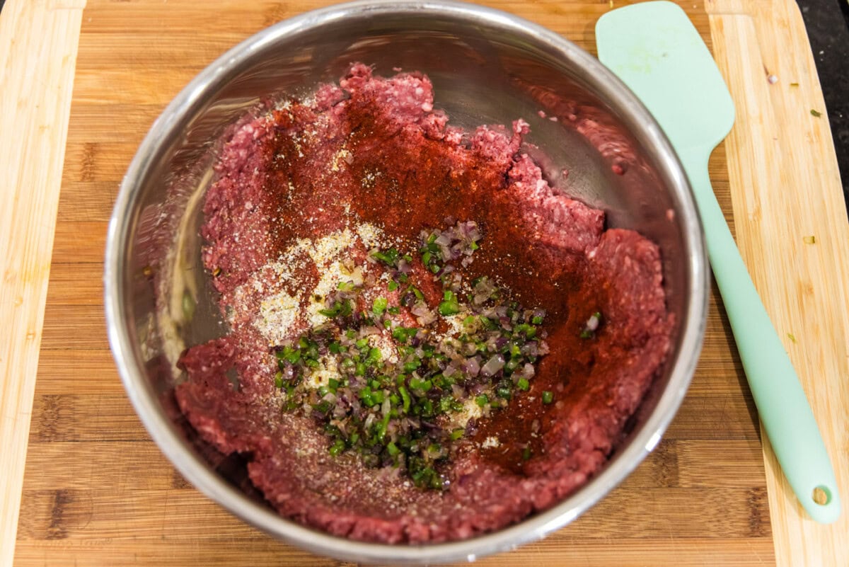 ground bison mixed with onion and jalapenos
