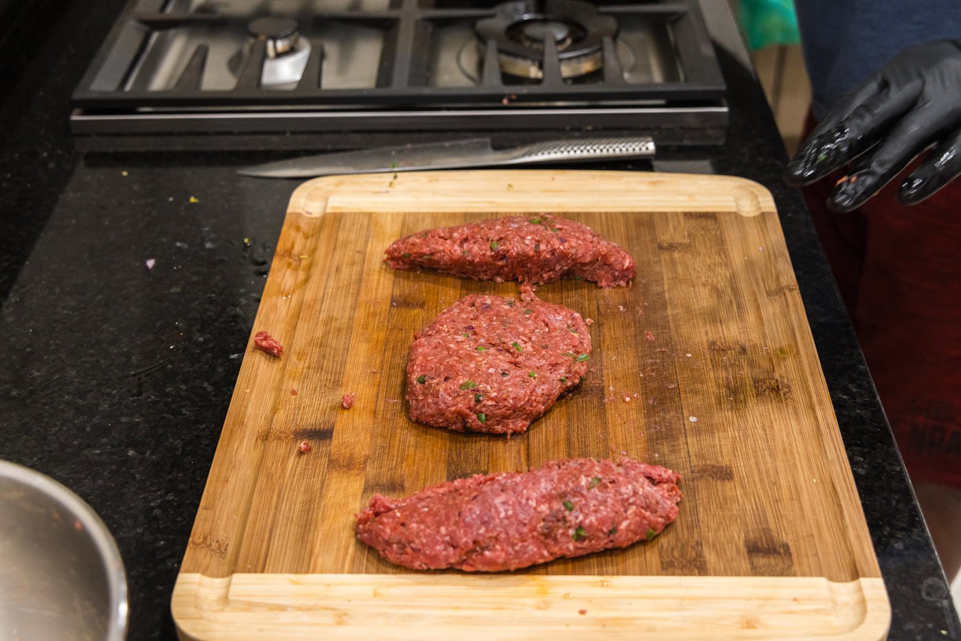 ground bison patties on a cutting board