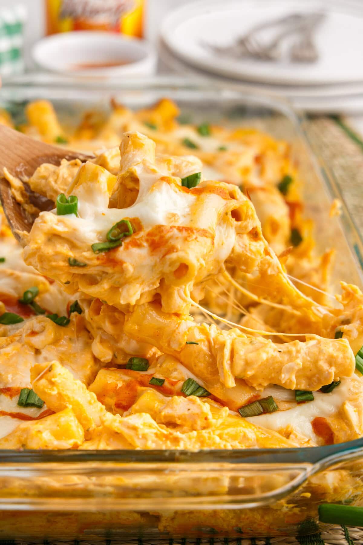 Spoonful of Buffalo Chicken Casserole being lifted out of the dish
