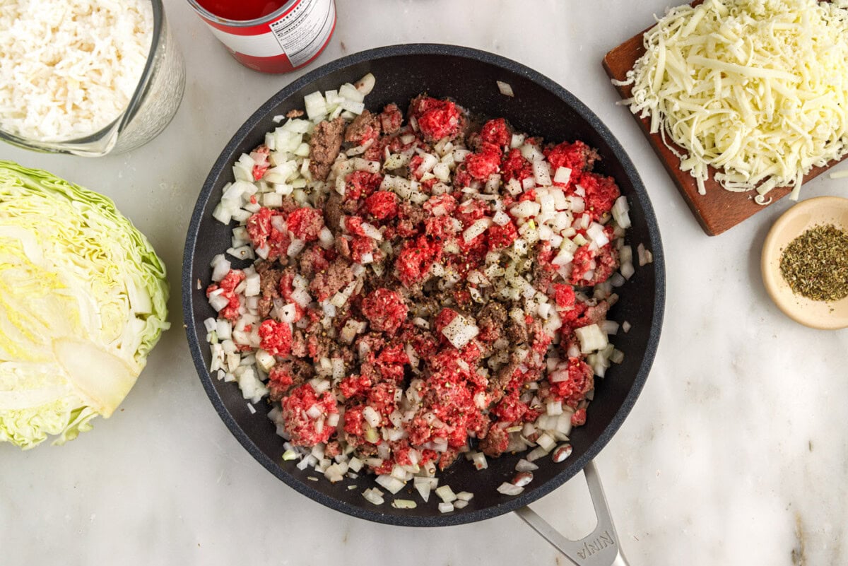 ground beef and onion in skillet