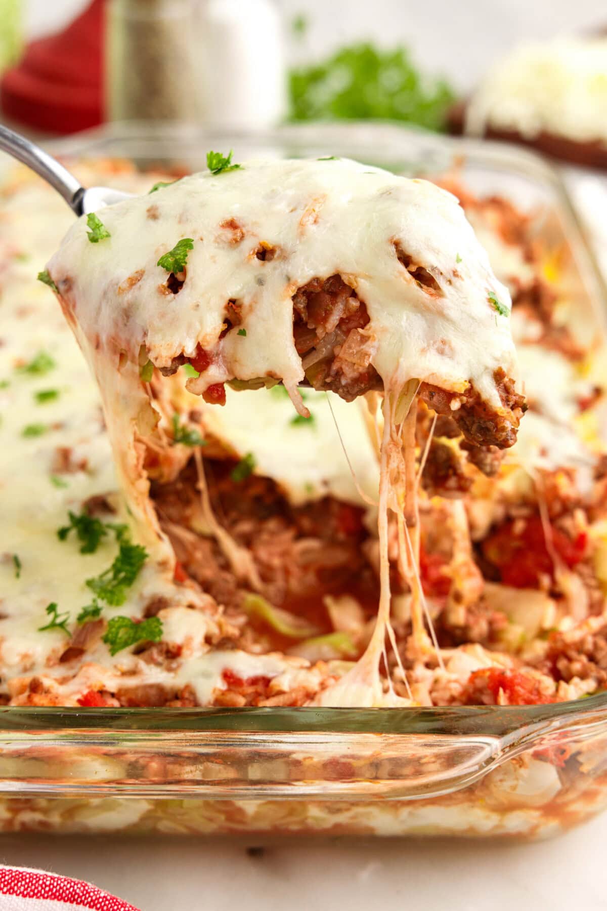 Scoop of Cabbage Roll Casserole being lifted out of the dish