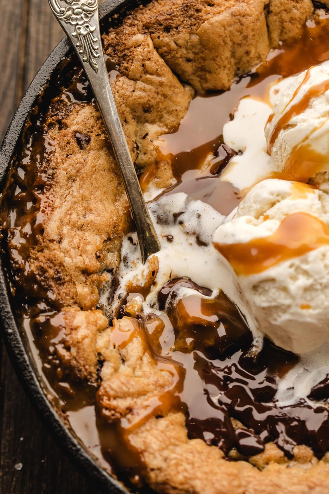 Spoon in a Chocolate Chip Caramel Skillet Cookie