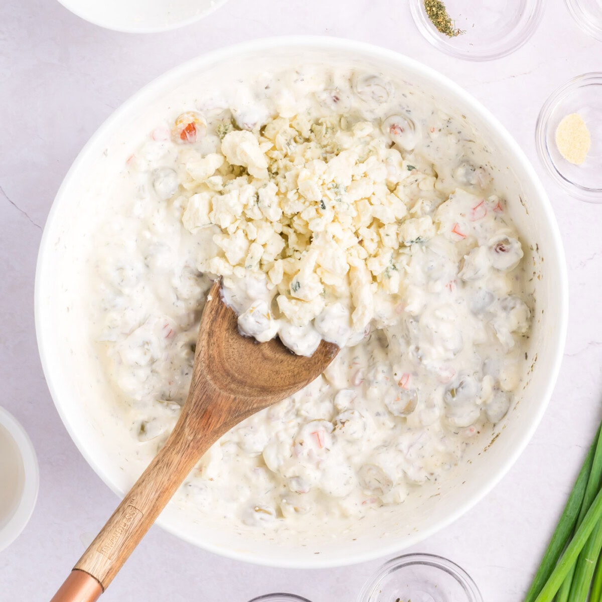 blue cheese crumbles added to martini dip