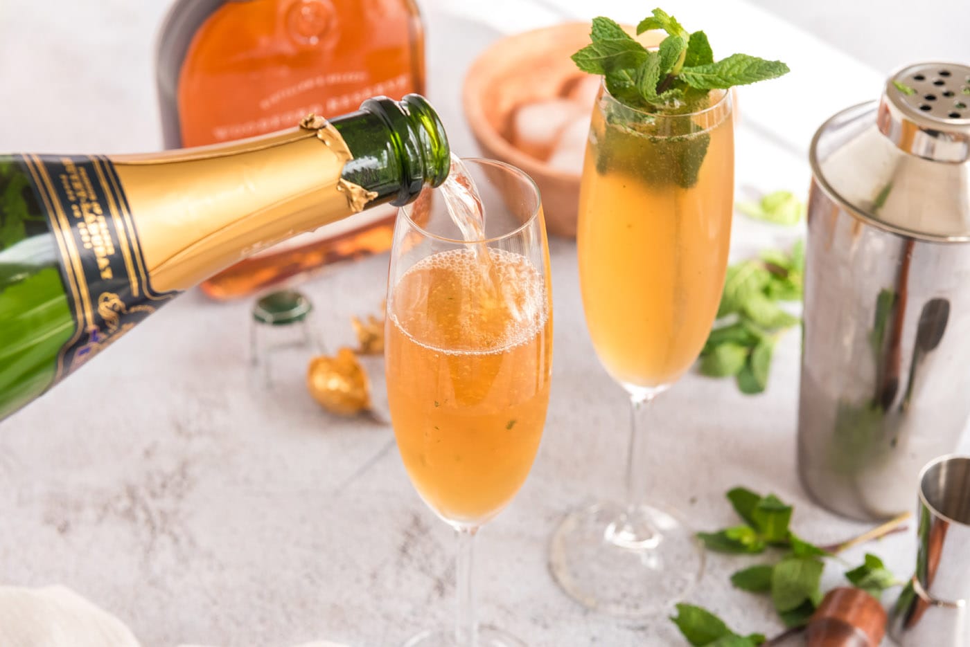 topping fizzy julep with champagne