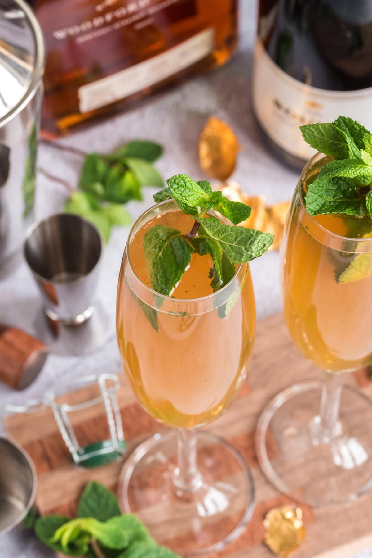 Two Fizzy Julep cocktails on a wooden board