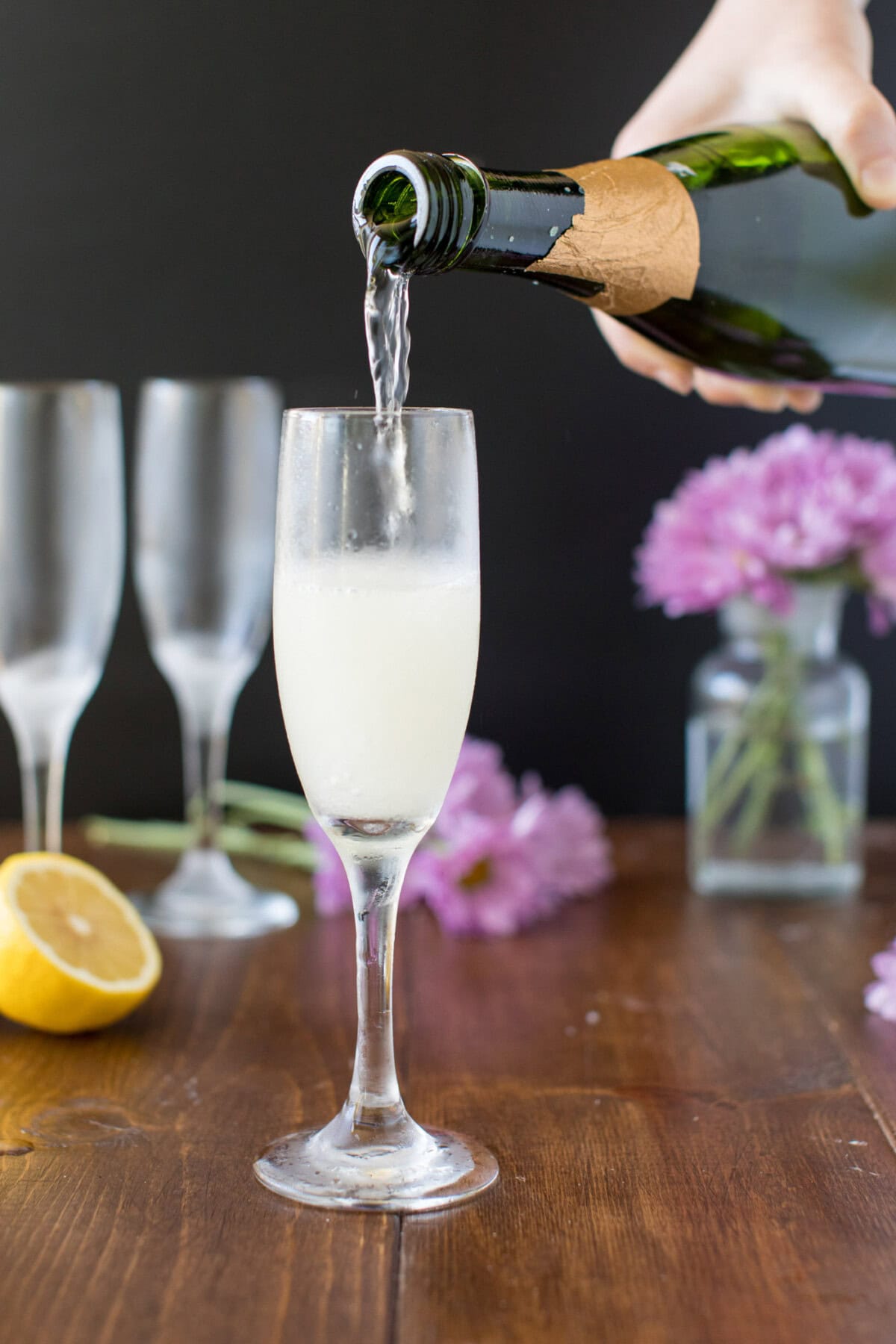 pouring champagne into a flute