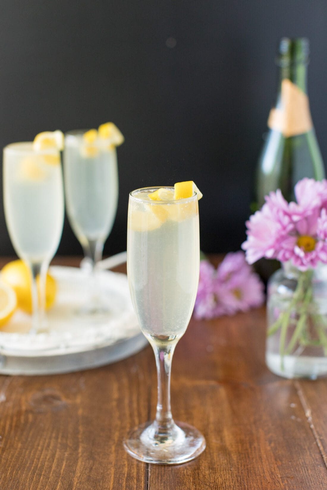 A French 75 garnished with a lemon twist