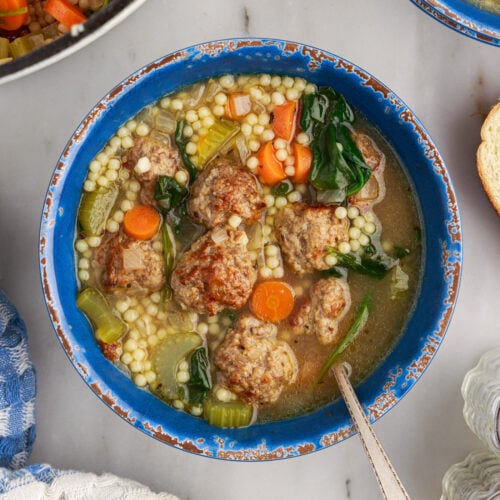 Bowl of Italian Wedding Soup with a spoon in it