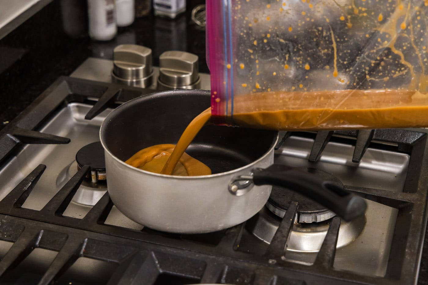 pouring miso marinade into a saucepan