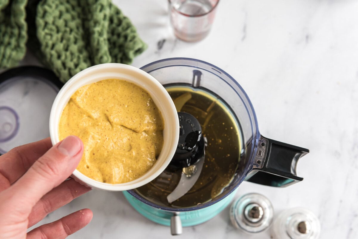 adding honey mustard to food processor