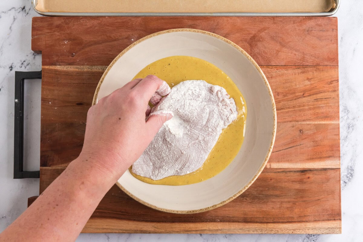 dredging chicken breast in honey mustard dressing