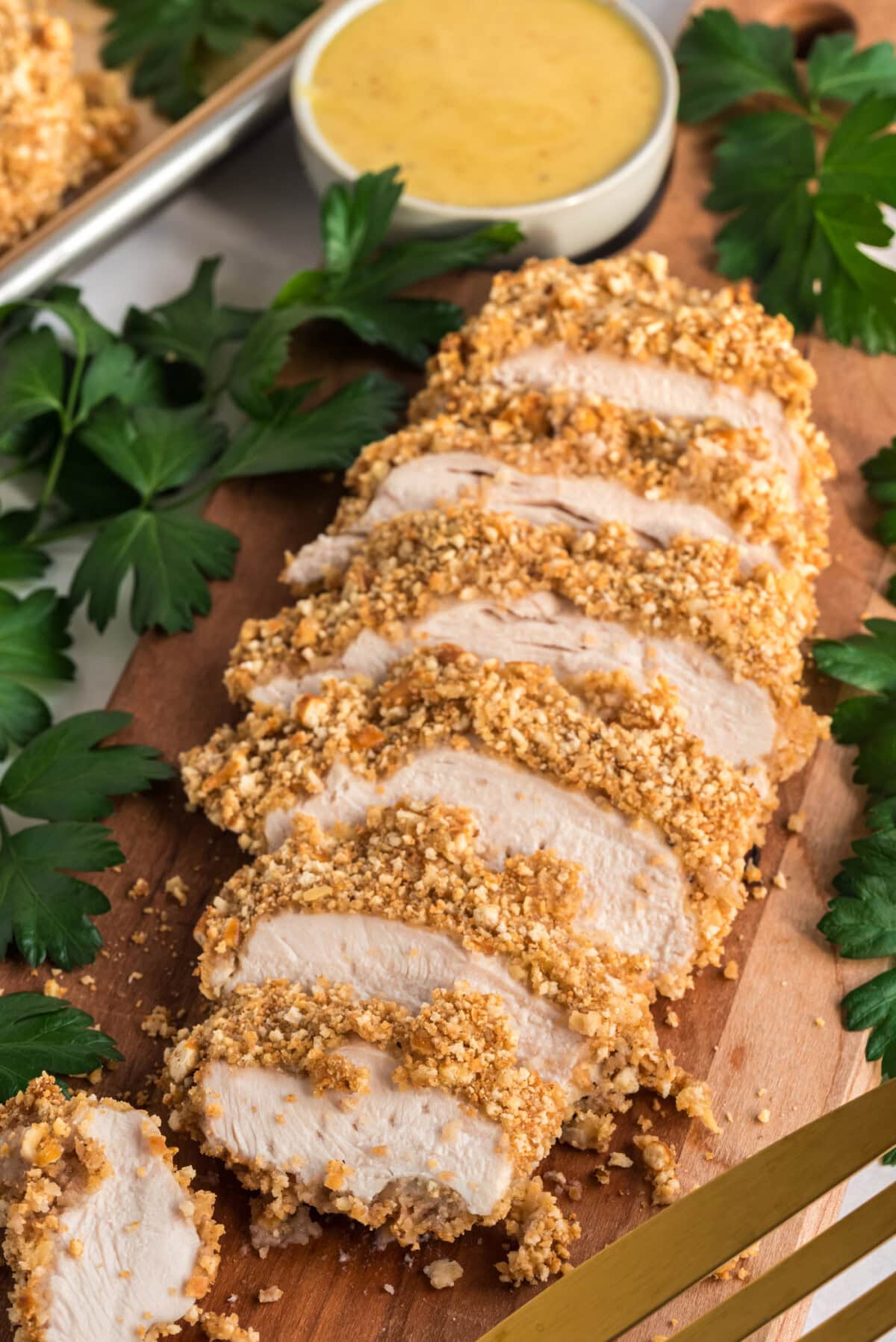 Sliced Pretzel Chicken on a wooden board