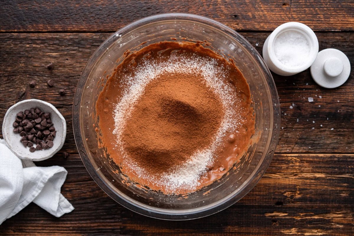Adding in the flour, salt, baking powder, and cocoa powder to cookie dough