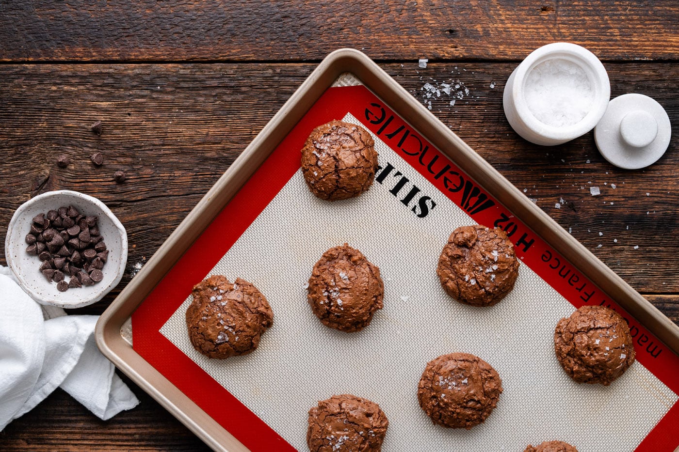 salted brownie cookies on a baking sheet
