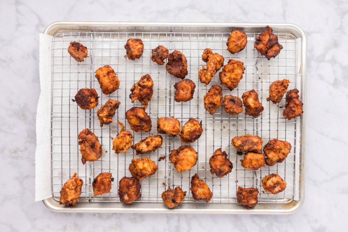 crispy fried pork on a wire cooling rack