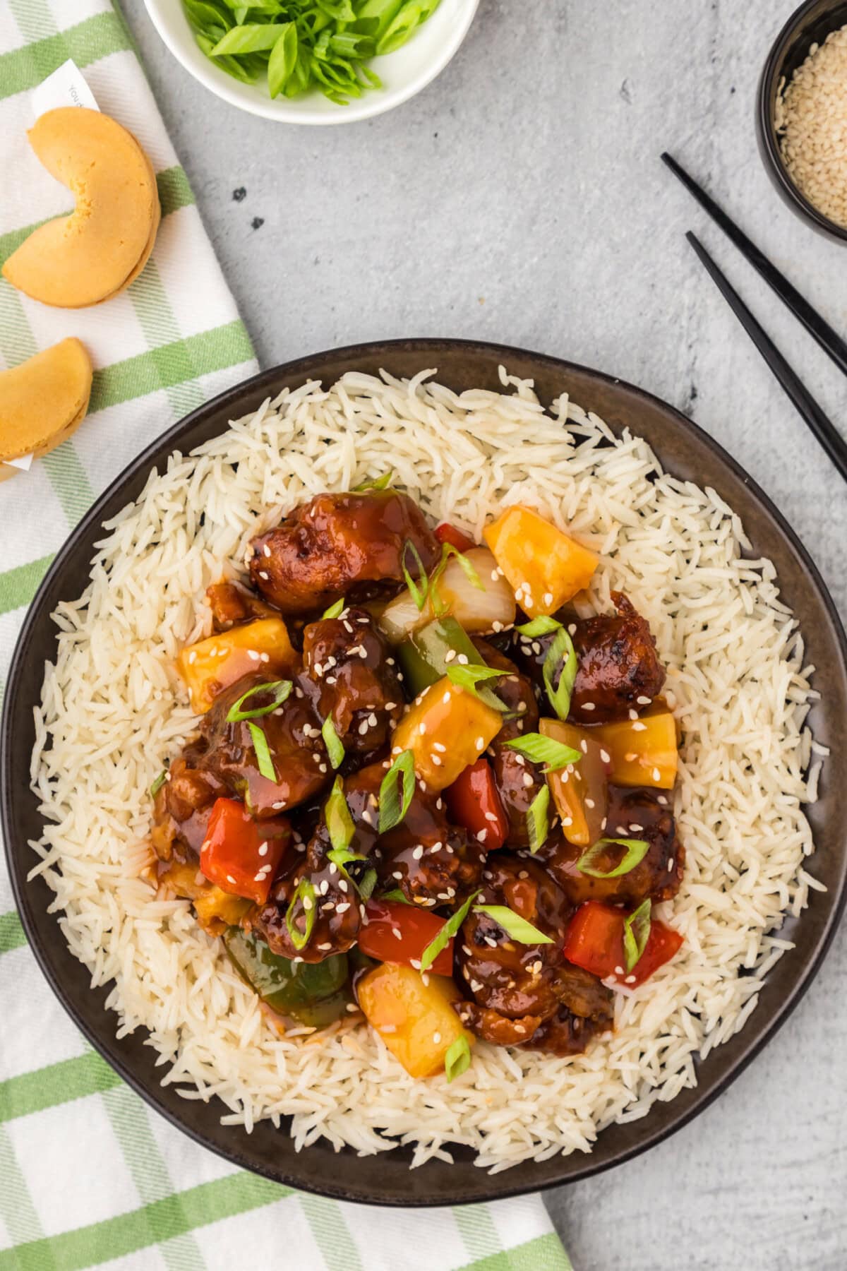 Sweet and Sour Pork served on a plate over rice