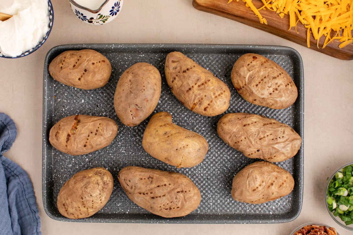 baked russet potatoes on a baking sheet