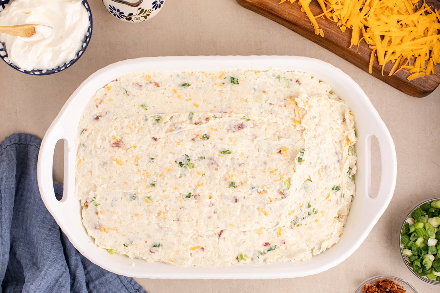 overhead of twice baked potato casserole in a dish