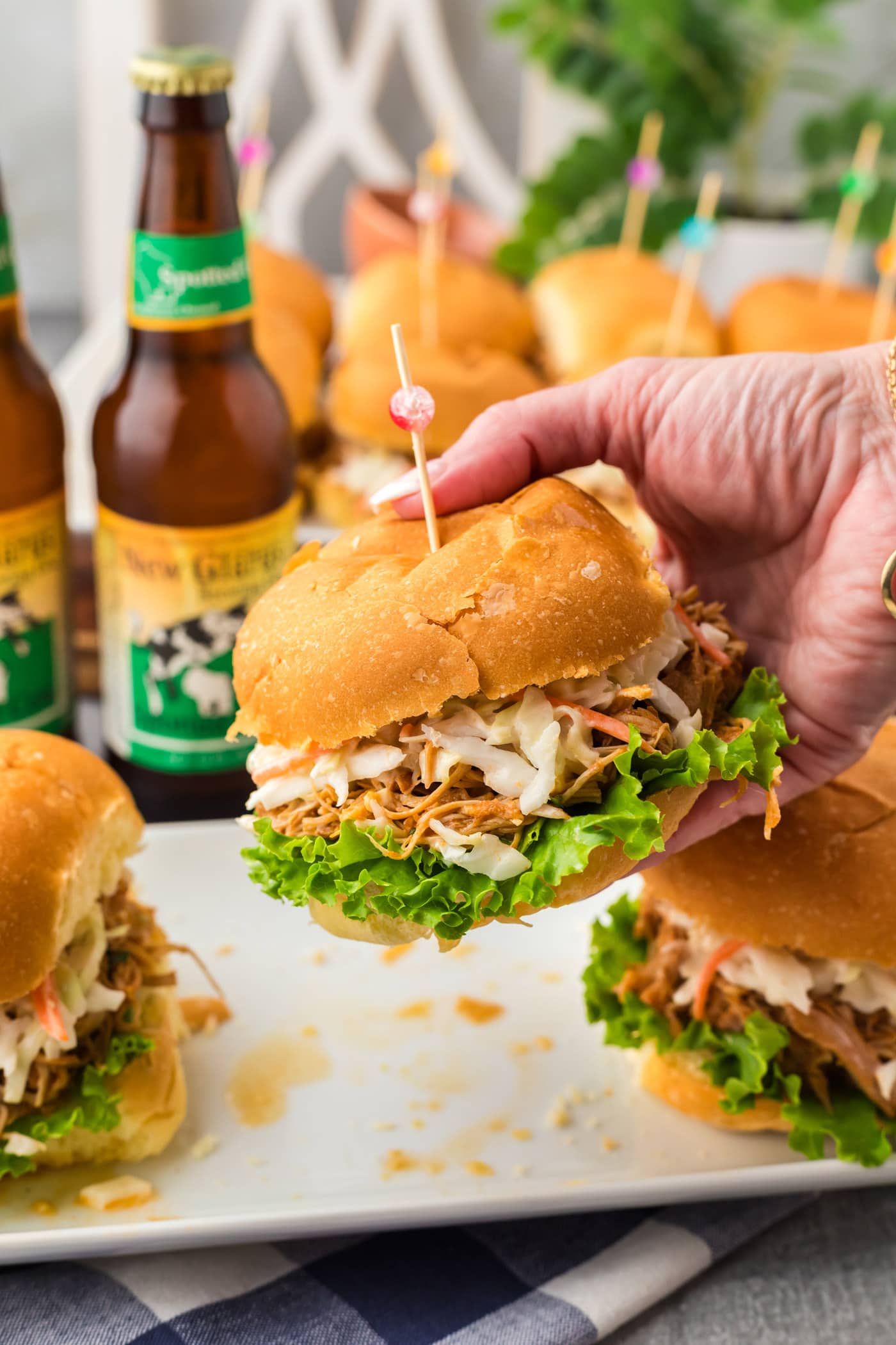 Hand holding up a BBQ Chicken Sandwich.