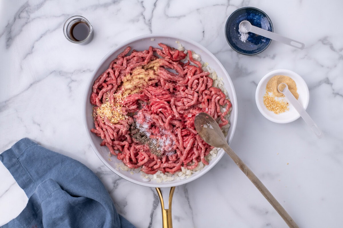 ground beef, seasonings, and onion in a skillet