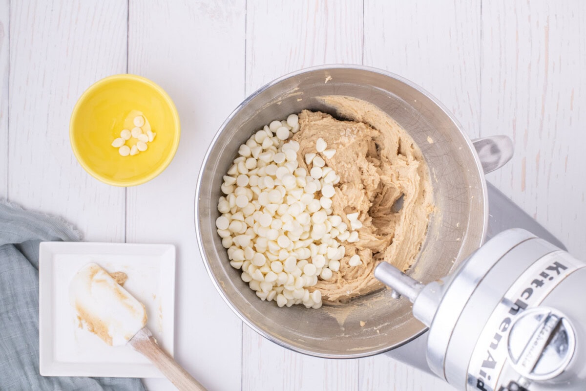 white chocolate chips in bowl of browned butter blondie batter