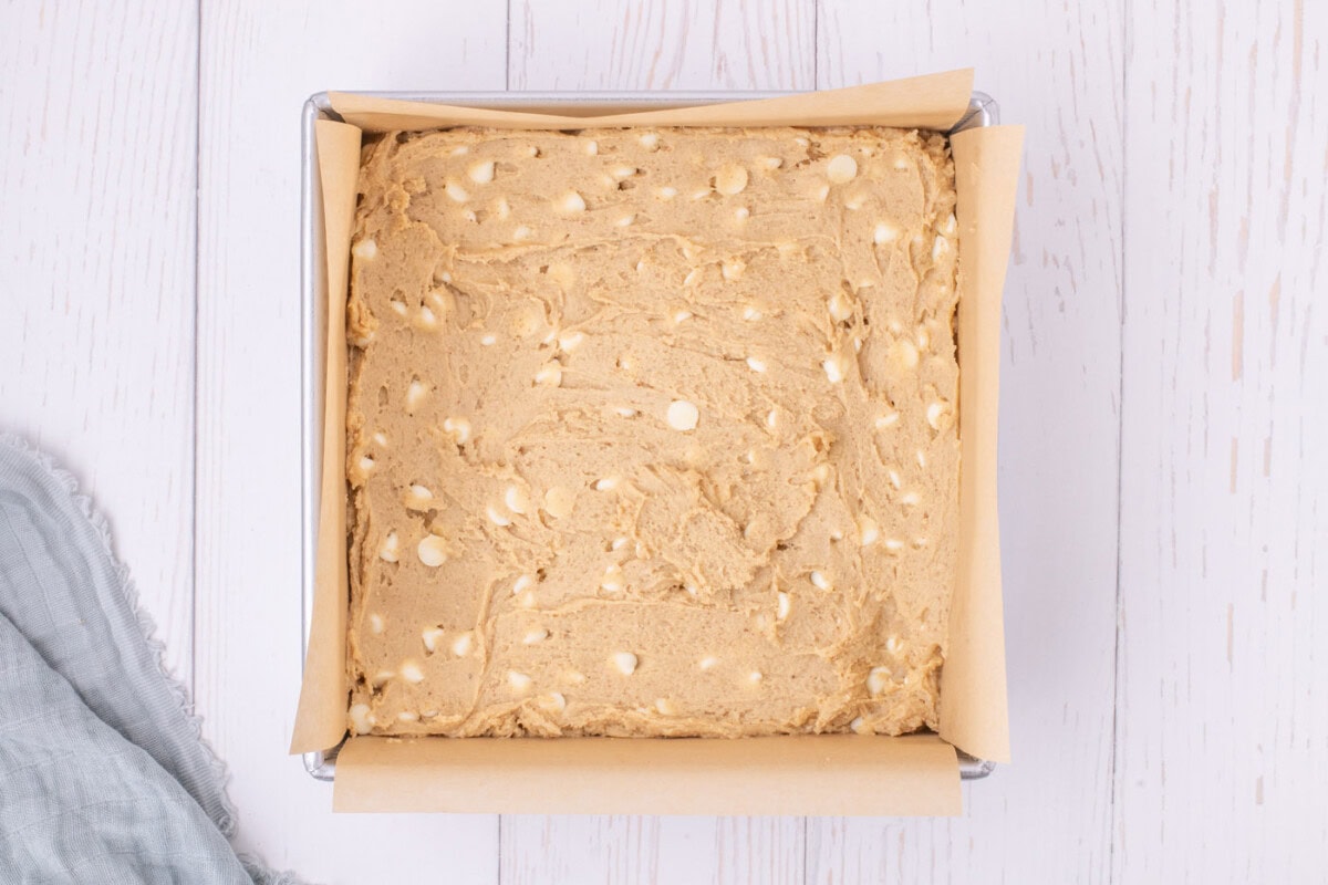 browned butter blondie batter in a baking pan