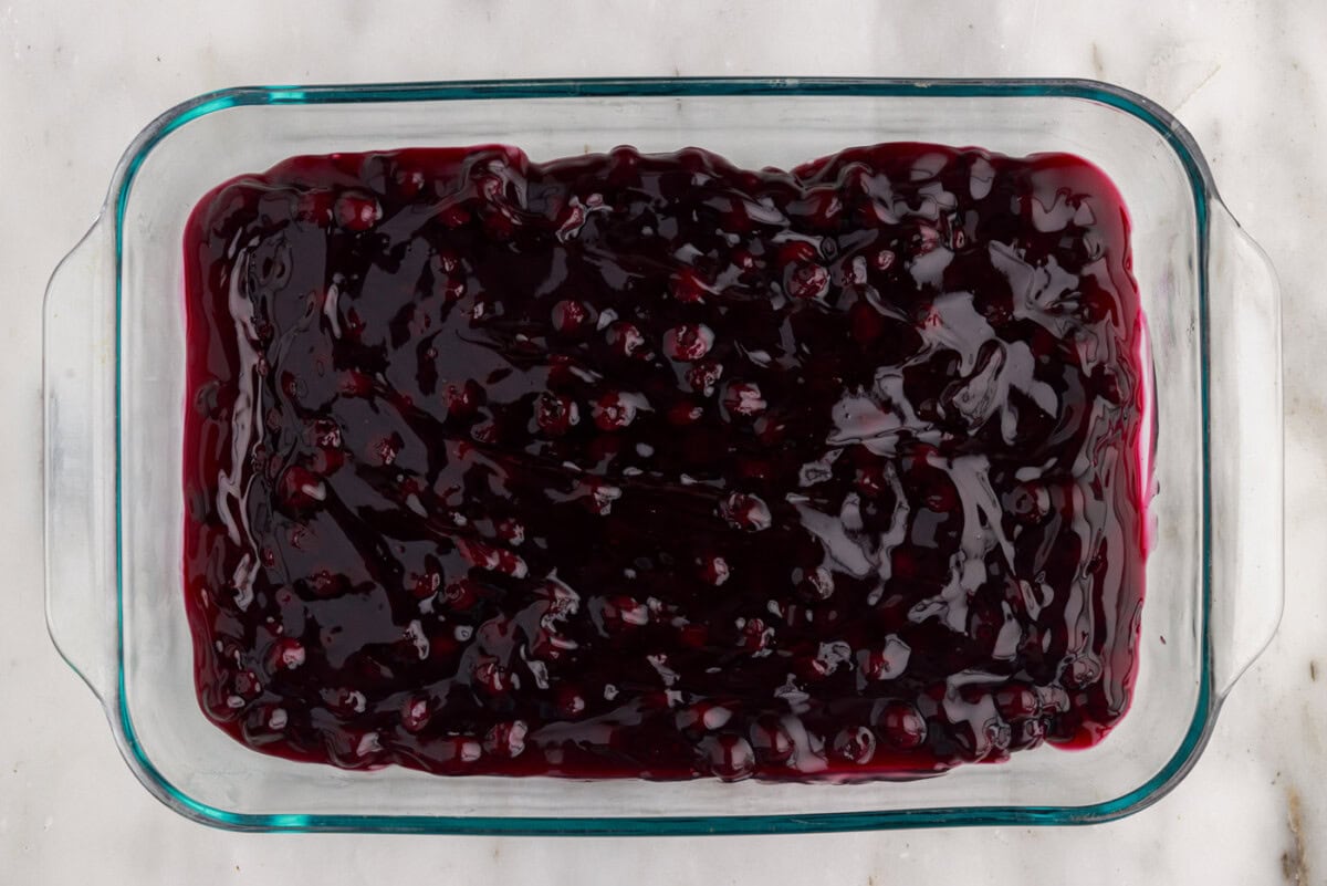 blueberry pie filling on bottom of baking dish