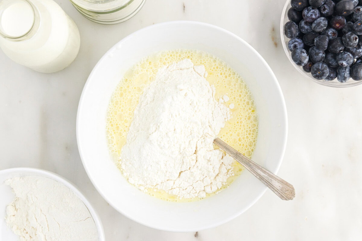 whisking wet and dry ingredients together in a bowl