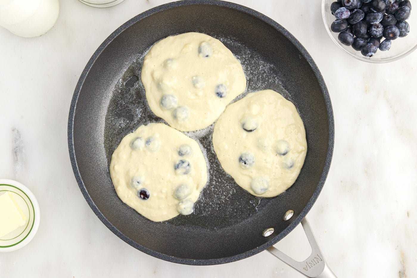fresh blueberry pancakes in a skillet