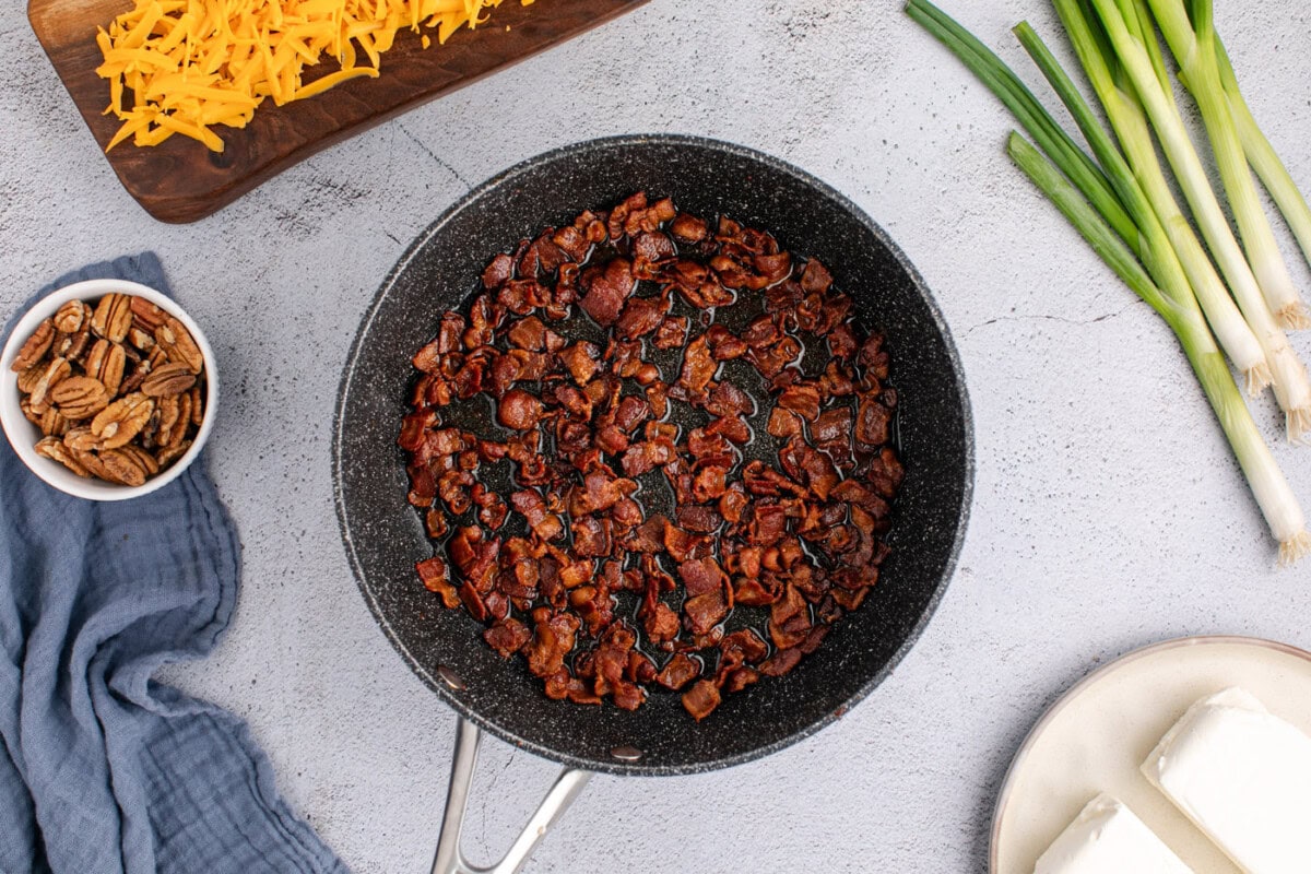 cooked bacon bits in a skillet