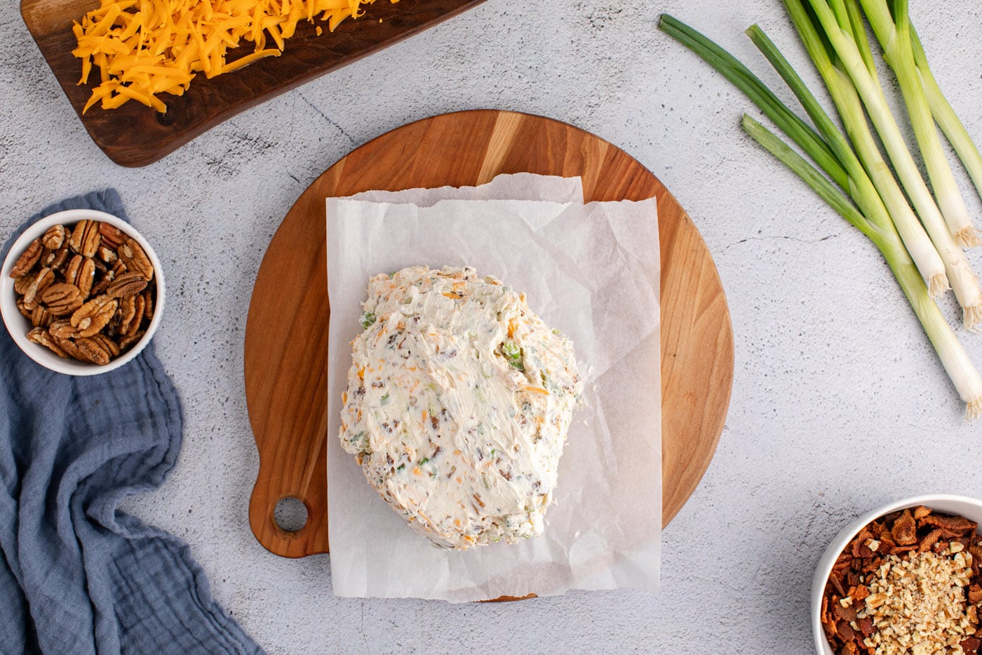 cream cheese cheese ball on parchment paper