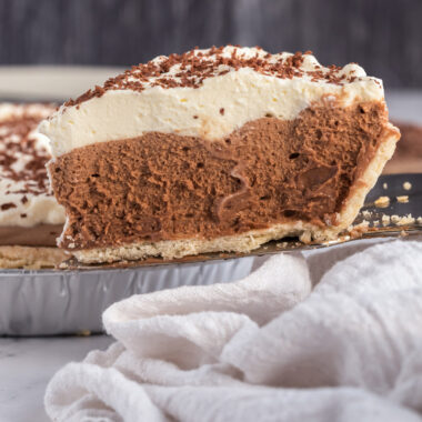 Slice of French Silk Pie being lifted up by a pie server