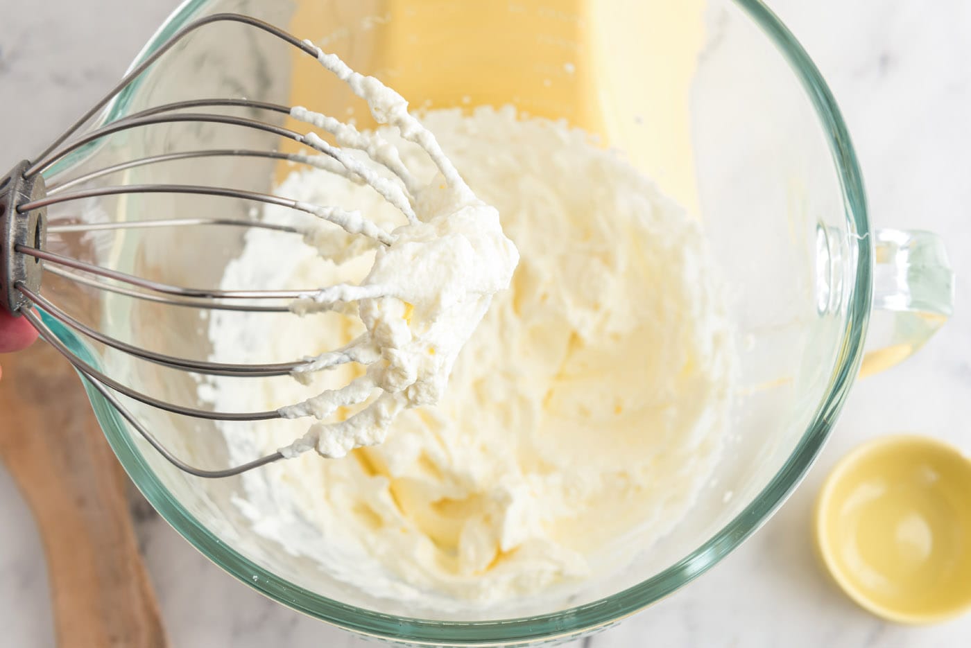 homemade whipped cream on a whisk attachment